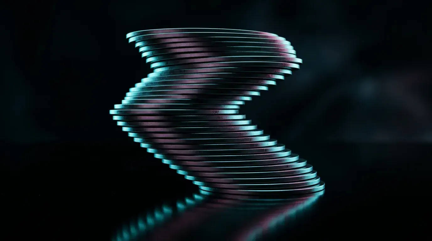 A tall stack of polished metal discs fanned into an S-curve on a black reflective surface, edges catching cyan light